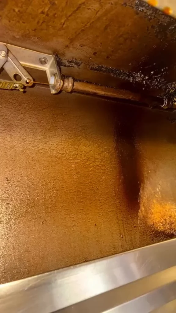 Grease film coating the inside of a kitchen hood