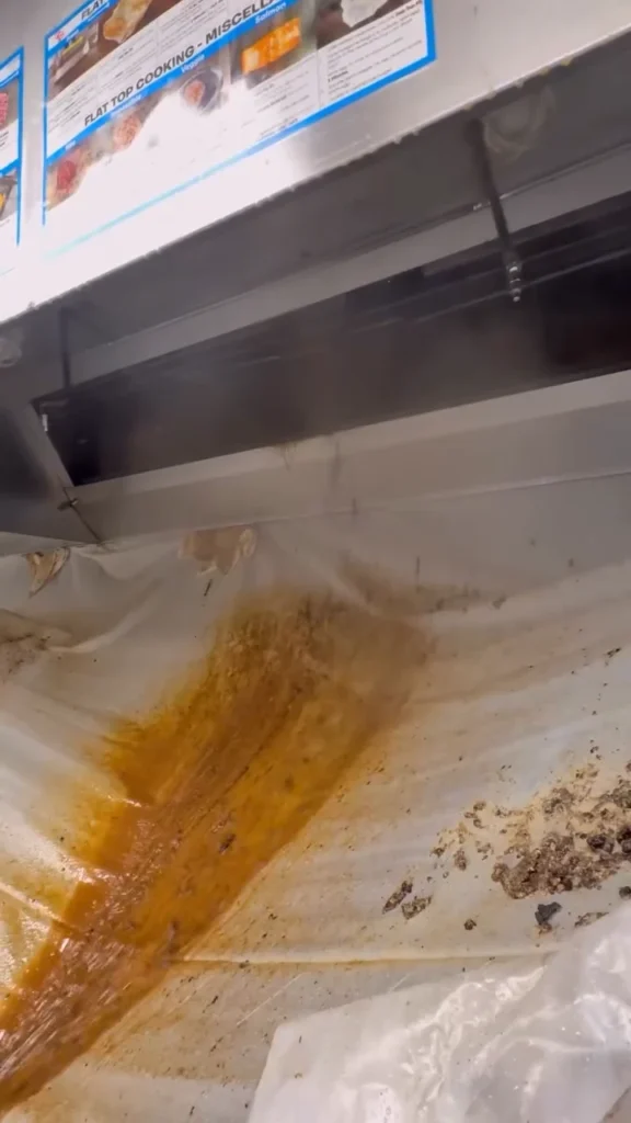 Kitchen hood with grease runoff during cleaning